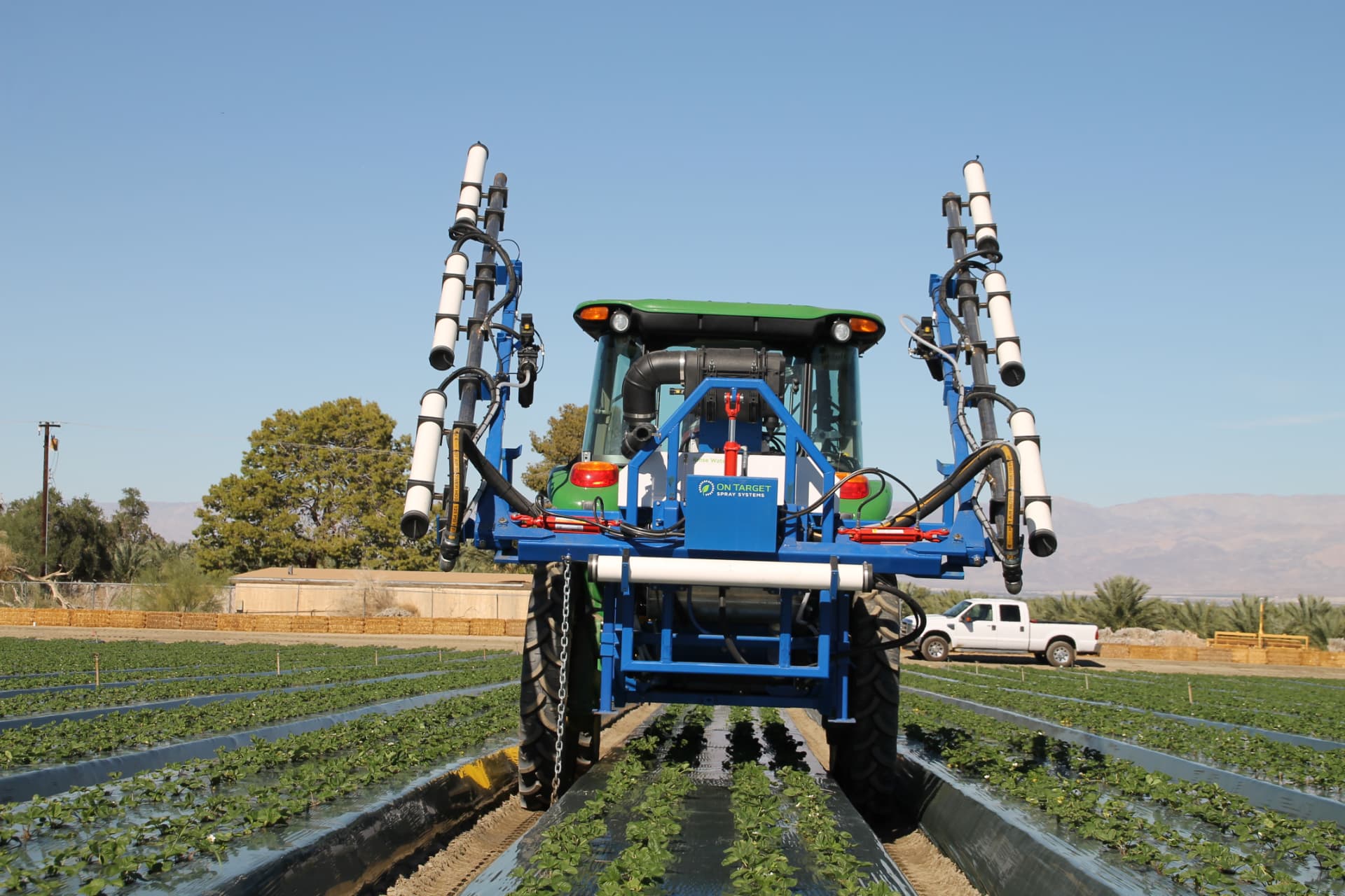 OnTarget multi-row strawberry sprayer with booms folded for transport